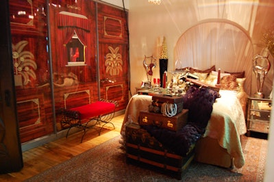 Gold bedding, leopard print pillows, and a black faux fur throw topped the bed in the sleeping car.