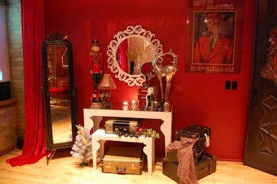 Vintage suitcases sat nestled beside a vanity in the room dressed as a sleeping car.