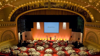 Orange lighting at the back of the stage reflected the Spertus Institute's signature hue.