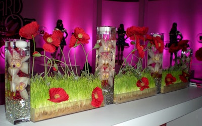 Red rose and grass floral beds from Triton Productions lined the long hightops separating 'The Ruby Slipper Collection' from the main bar.