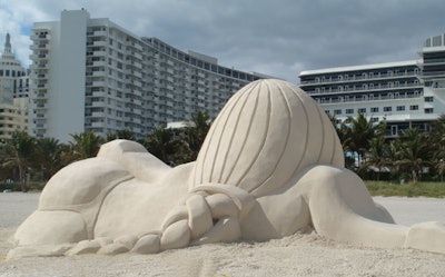 Swiss artist Olaf Breuning's 150-ton sphinx sand sculpture as it looked from behind.