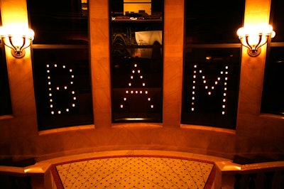 Floating candles formed the company's logo in the windows of the stairwell.