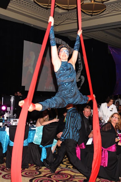 An aerialist was one of many performers during dinner.