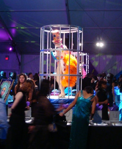 Las Vegas-style cage dancers were centered among all the silent-auction lots to entice bidders.