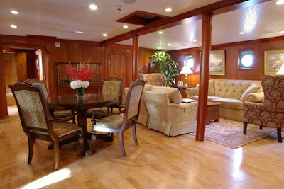 The owners refitted the interior of the ship in 2000, paneling the walls with wood and designing a layout that includes bedrooms, a dining room, and an area for games.