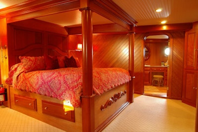 The ship offers five guest rooms, including a master bedroom with a mahogany four-post bed.