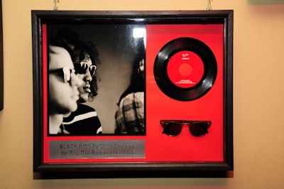 Display cases with the sunglasses, 45s of the bands' music, and original photography of the artists lined most of the venue's walls.