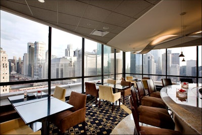 Wrapped in floor-to-ceiling windows, Cityscape peeks out onto the Merchandise Mart and the Chicago River.