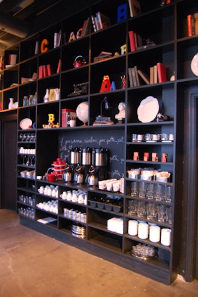 School supplies, books, teapots, apples, and dishes fill cubbyholes, which can be set up as a self-serve counter for meetings.