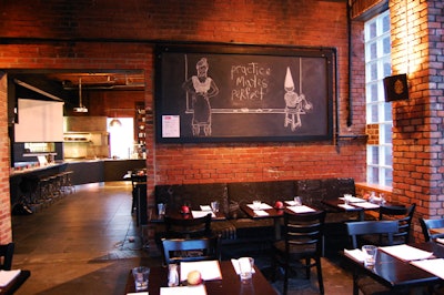 Chalkboard sketches by artist Chris Musina hang on the walls and above the counter in the main café space.