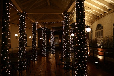 Strings of white lights wrapped the columns of Cafe Brauer's tented patio.