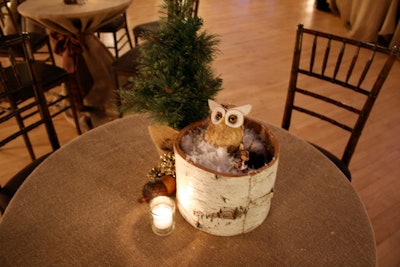 Pine-cone owls, oversize acorns, and mini pine trees brought a woodsy feel to each table.