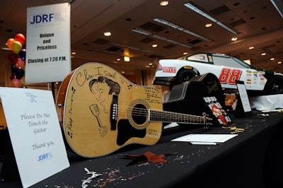 The 500-lot silent auction featured a guitar signed by singer Chris Isaak.
