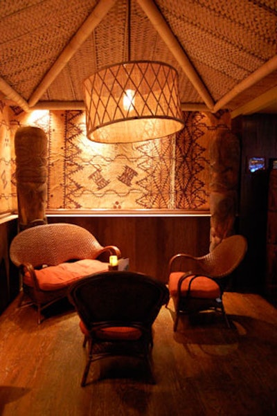 A lounge area in front of the space features a thatched roof that recalls a tiki hut.