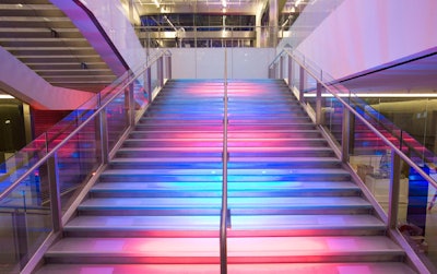 The glass staircase between the first and second levels can be lit in a combination of colors.