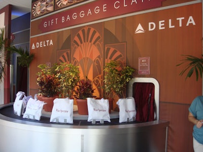 Upon arrival at the 2008 South Beach Wine & Food Festival, guests were greeted at the airport-themed Delta Welcome Center with 'boarding passes' that got them into the event and gift bags, by way of the baggage-claim conveyor belt.