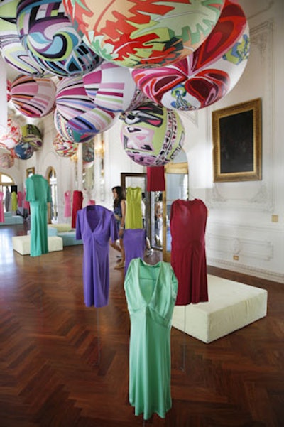 Visual artist Gerard Cholot hung Emilio Pucci garments from oversize balloons draped in his Pucci's signature fabric at a brunch honoring the late designer and his 60 years of work.