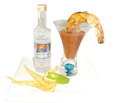 Grilled shrimp marinated in pineapple juice are added to a shot of flavored vodka, accompanied by two freshly squeezed limes and a dash of wasabi powder, at Events by Amore in Tampa.