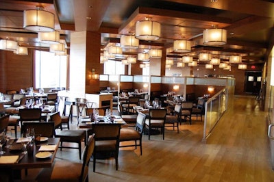 The bilevel main dining room features custom chandeliers and a modern take on Georgetown's architecture.