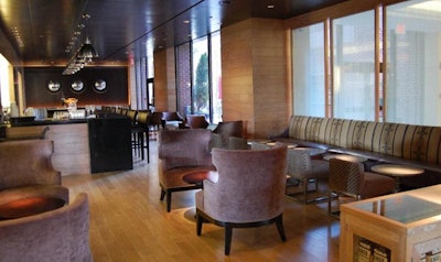 A set of three dome mirrors on the far wall is the focal point of the bar and lounge area.