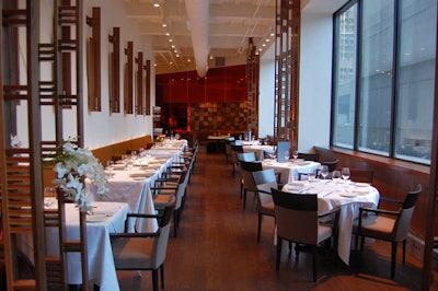 White linens, Wedgwood flatware, and Spiegelau wine glasses top tables in the dining room off the Richmond Street entrance.