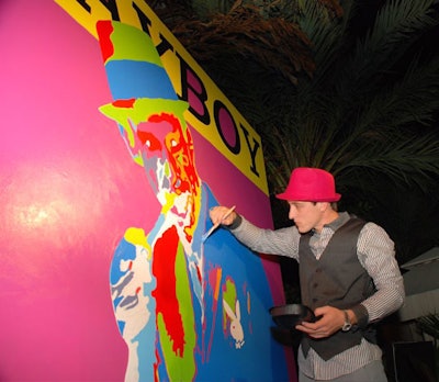 Artist Ryan Paul Simmons painted an oversize portrait of Hugh Hefner during the Playboy party at Karu & Y.