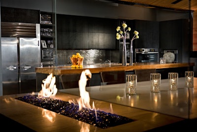 A modern kitchen doubles as a main bar.
