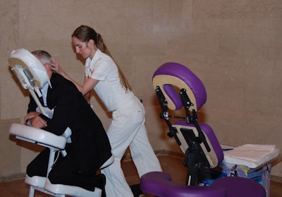 While waiting for their clothing to be steamed, some guests received mini massages.