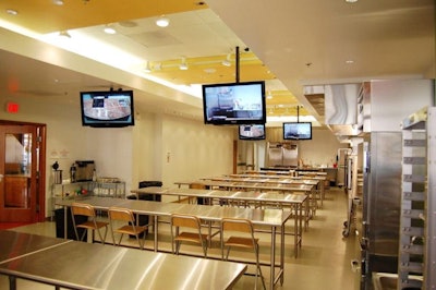 Food Works, the larger of the two kitchen studios, features stainless steel counters and four 37-inch flat-screen TVs.
