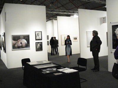 Stark white walls separated gallery spaces where guests examined photography at Photo L.A.