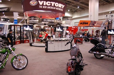 Manufacturer Victory's exhibit, the show's most interactive, featured a revolving cycle and four flat-screen TV's.