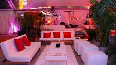 White leather lounge groupings accented with red highlights-reserved for V.I.P.s-were placed throughout the contemporary South Beach area.