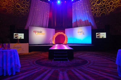 Planners decided to anchor the room with a co-branded stage and a long, illuminated catwalk.