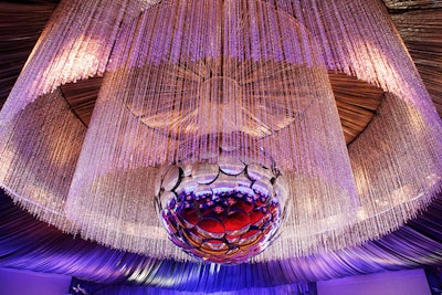 A large magenta and silver ball hung from the fabric-draped ceiling.