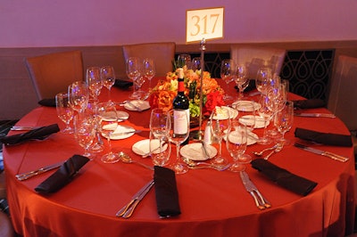 Dark orange tablecloths and flowers were meant to evoke the Australian outback.