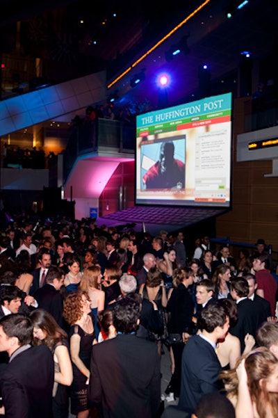 Two giant 16- by 16-foot laptops were the hub of the evening's interconnectivity, where guests could post their own photos and videos.