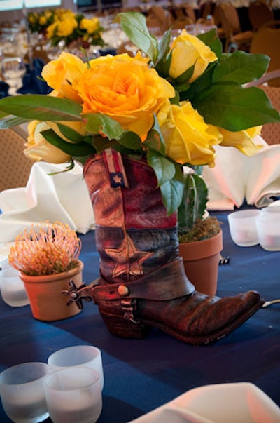 In the V.I.P. Maryland ballroom, miniature cowboy boot centerpieces held Texas's signature yellow rose.