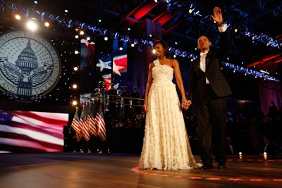 The Obamas made their first stop of the night at the Neighborhood Ball at the convention center, where Beyoncé sang 'At Last' for the couple's first dance.
