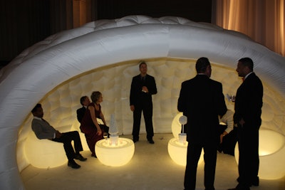 Inflatable igloo-like cabanas and glowing furniture accented Google's ball at the Mellon Auditorium.