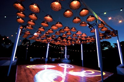 Levy Lighting NYC engineered an outdoor dance floor for a private event in East Hampton in August. A steel structure with a low profile frame held rows of wicker baskets lit from within. Sound-sensored LED tubes covered the sides of the structure, and additional overhead lights projected moving patterns on the dance floor.