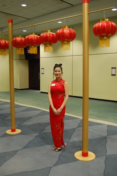 Greeters dressed in traditional Chinese gowns welcomed guests to the event.