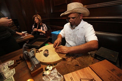 A representative from Staten Island's the Little Cigar Factory hand-rolled cigars for guests interested in smokable souvenirs.