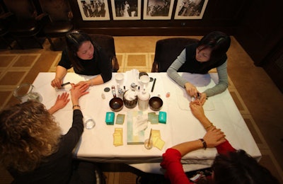 Workers from Spa Chinois gave female guests free manicures while they sipped on cocktails.