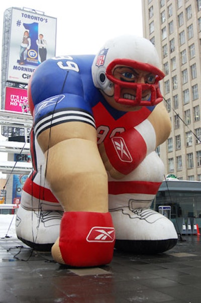 An inflatable football player added to the theme at Yonge-Dundas Square.
