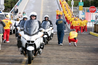 A motorcade escorted the runners.