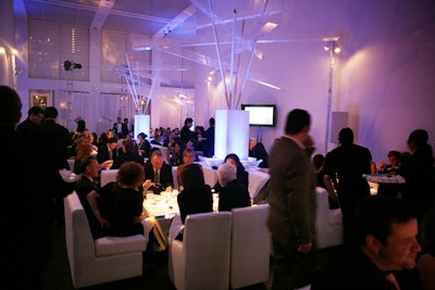 In lieu of traditional tables, white lounge areas hosted guests for dinner.