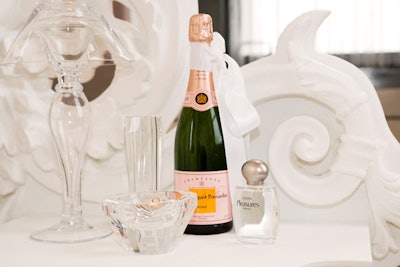 Brides partnered with sponsors like Veuve Cliquot to furnish the suite with items typically found in a honeymoon bedroom.