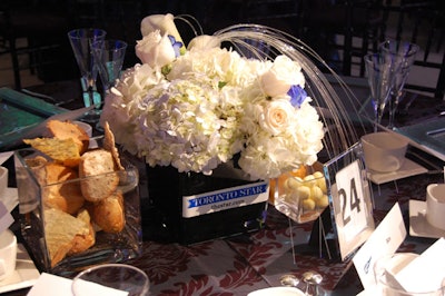 Eclectic Events topped tables with blue and white centrepieces for the luncheon sponsored by the Torstar Group.