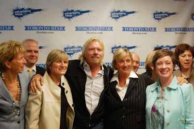 Sir Richard Branson posed for photographs with V.I.P. guests during a reception prior to the luncheon.