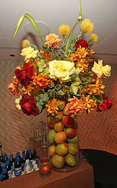 Kehoe placed vases filled with mangoes and flowers on the bars.